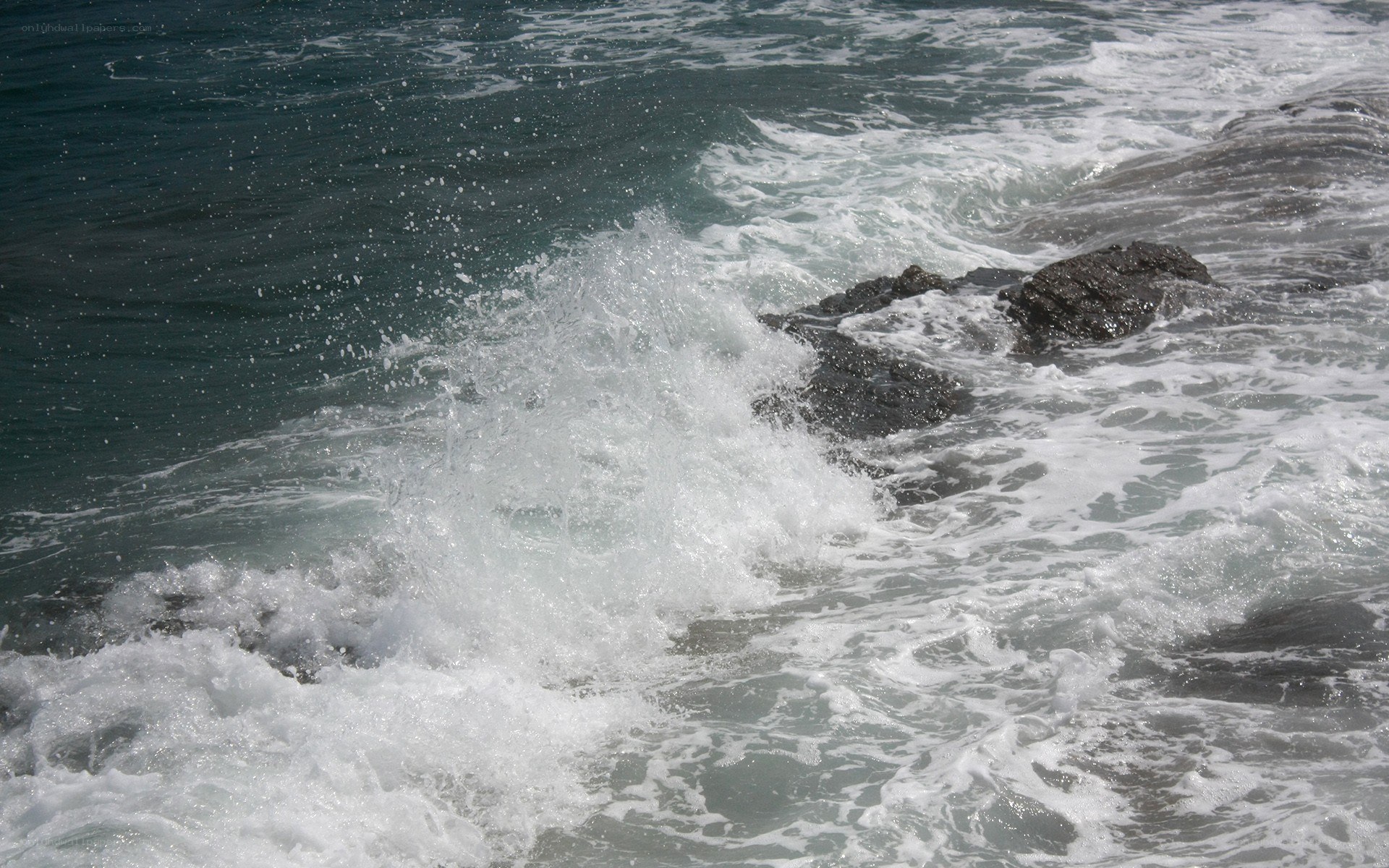 Waves crashing on rocks