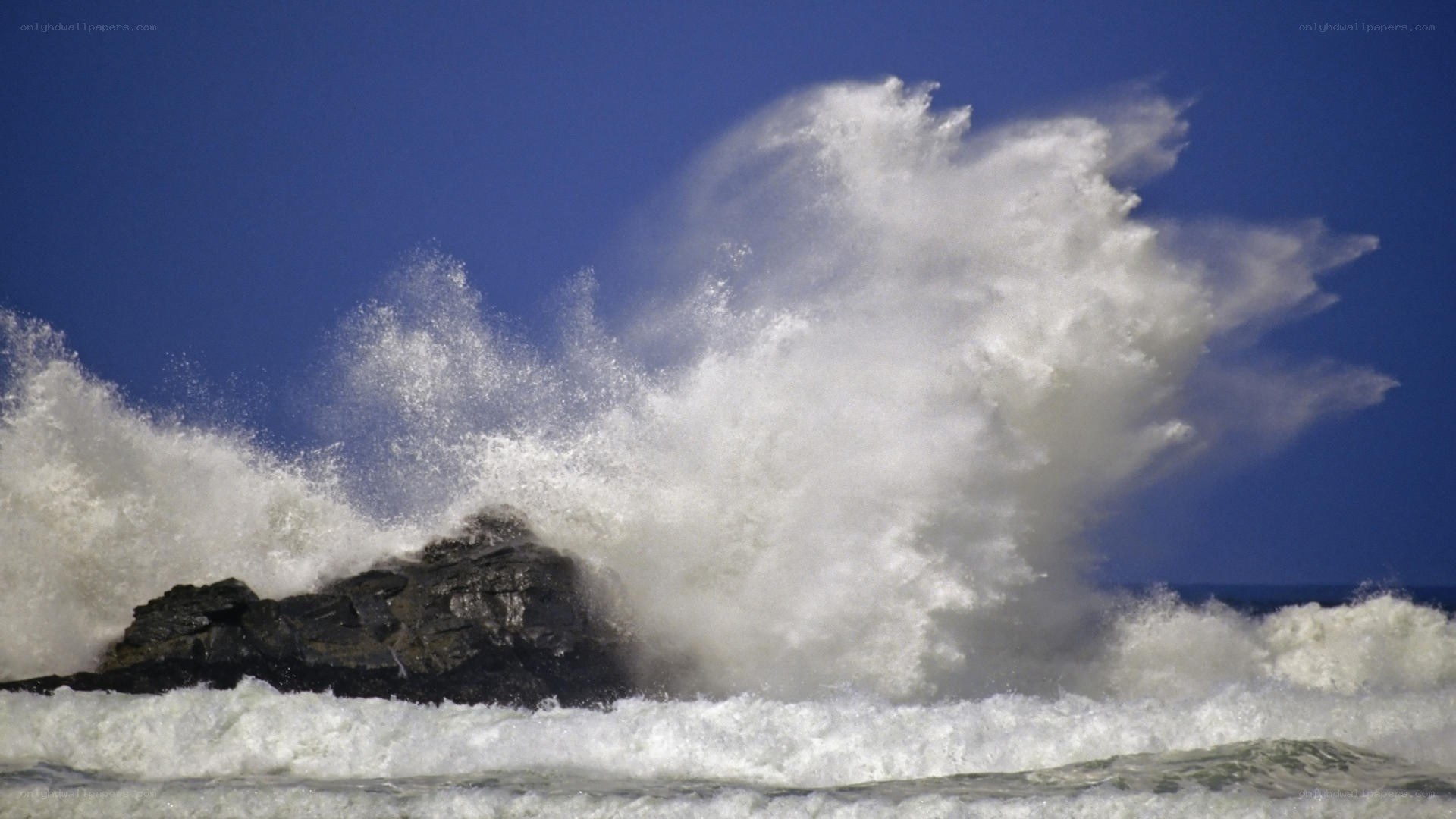 Waves crashing on rocks