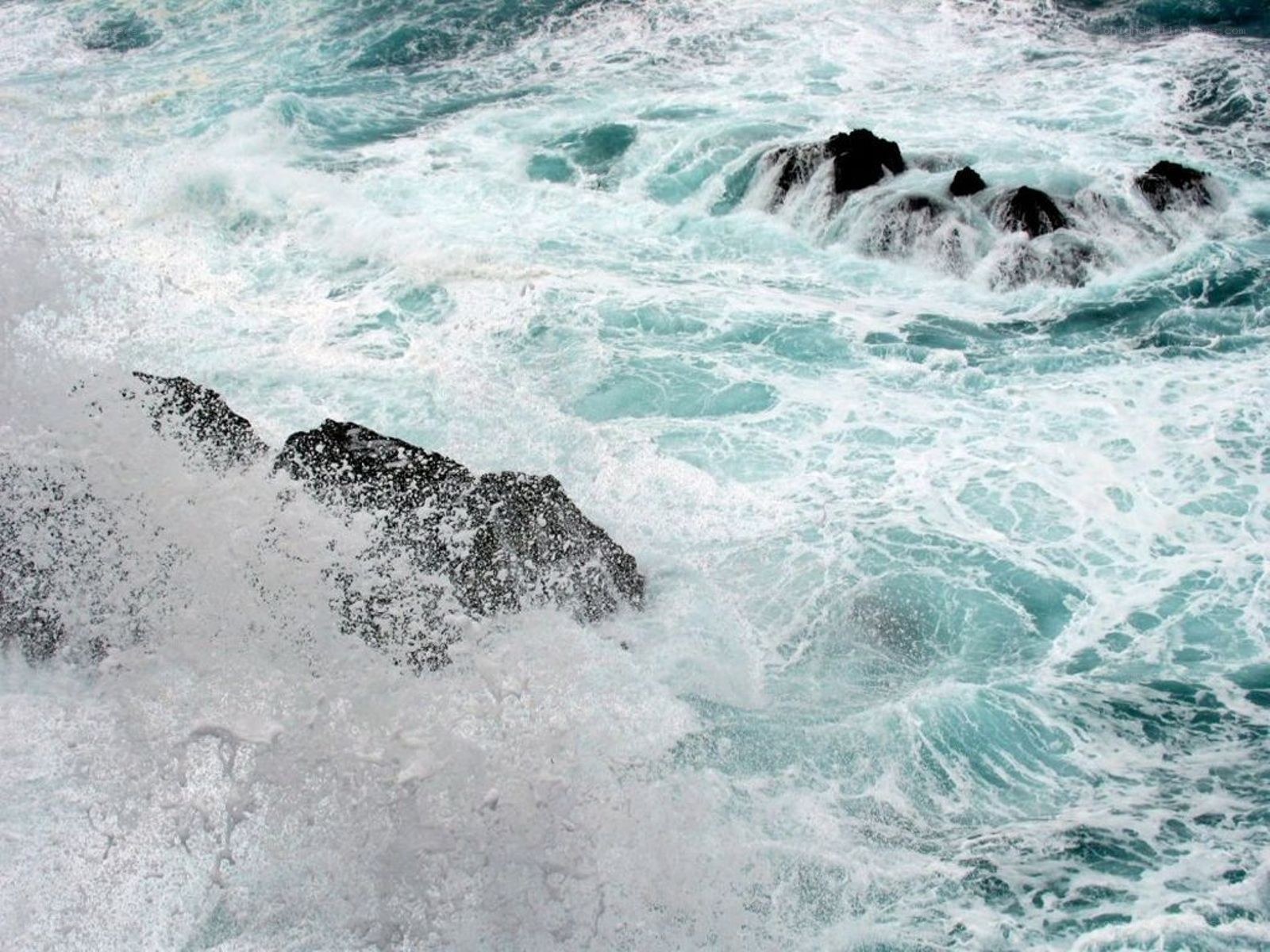 Waves crashing on rocks