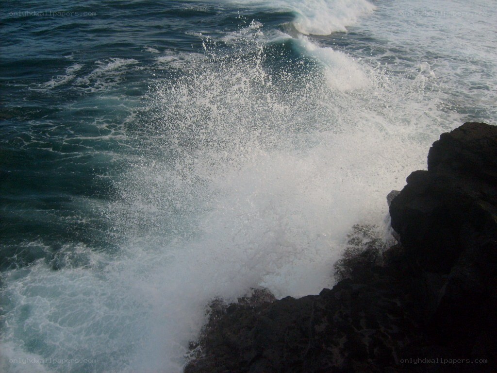 Waves crashing on rocks