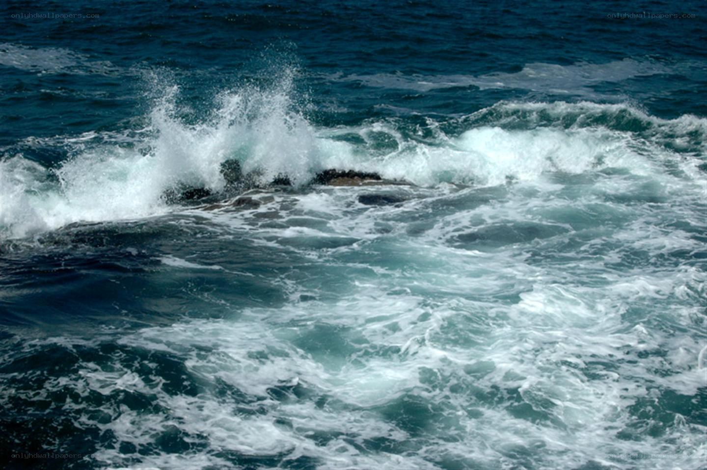 Waves crashing on rocks