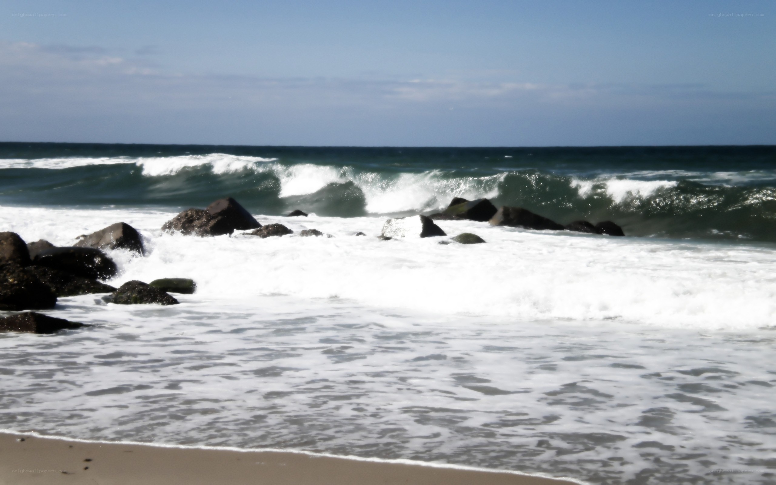 Waves crashing on rocks at beach