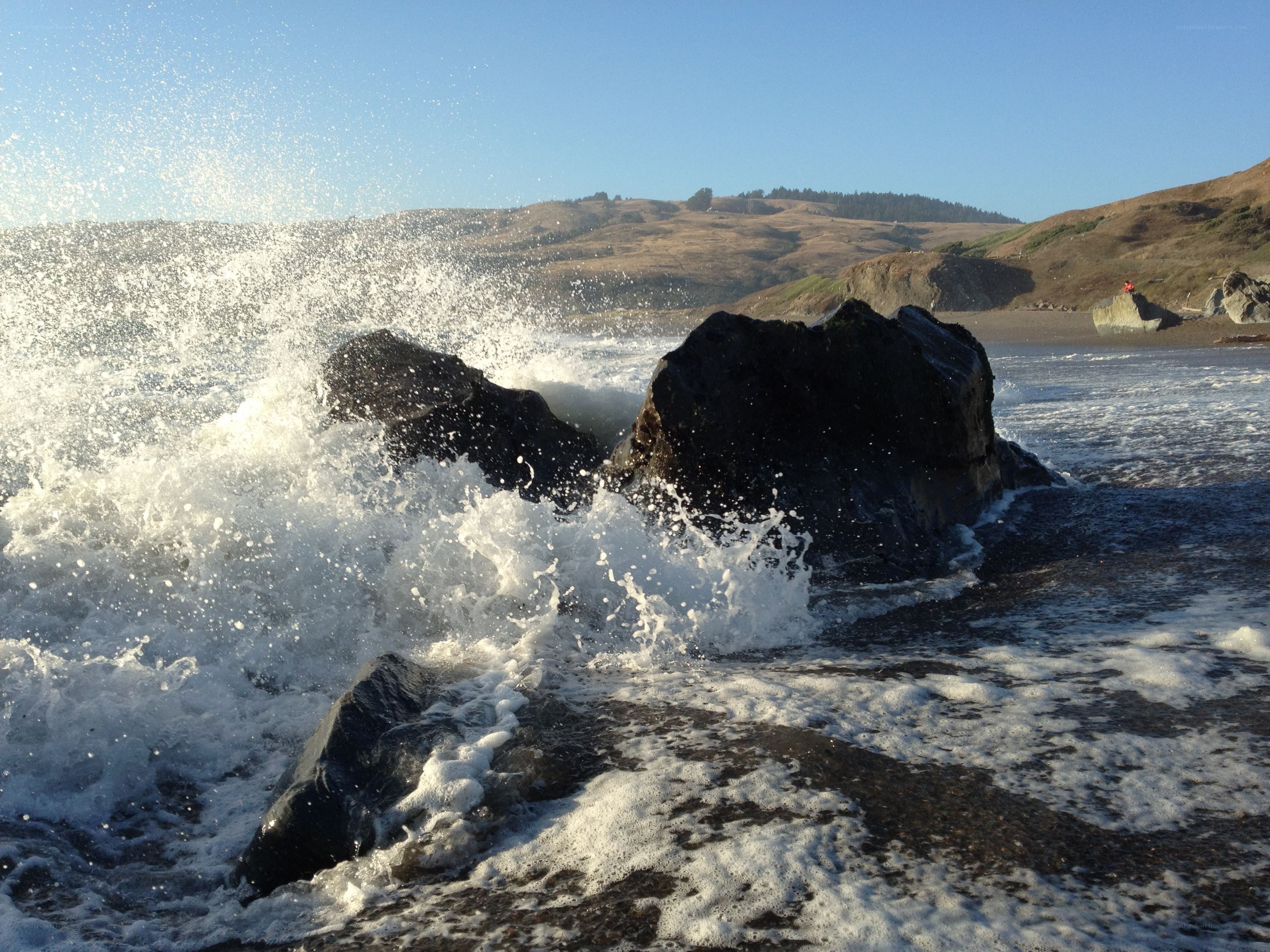 Waves crashing on rocks at beach