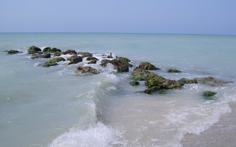 Waves crashing on rocks at the shore