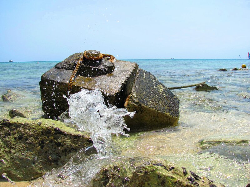 Waves Crashing on Rocks — Blue, Calm, Afternoon, Photograph, Ocean, Boat