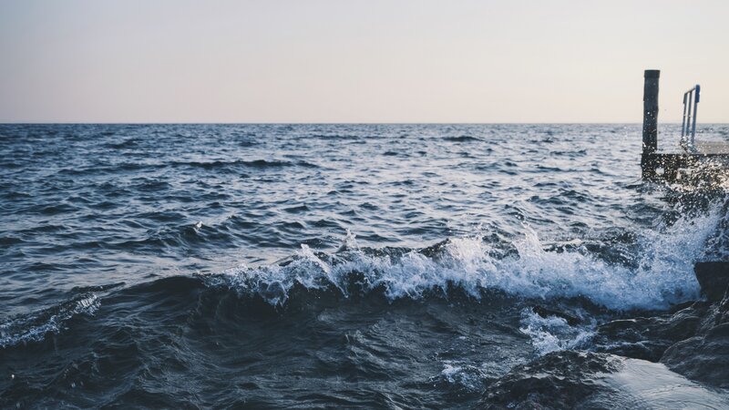 Waves Crashing on Rocks — Blue, Calm, Sunset, Photograph, Ocean, Dock