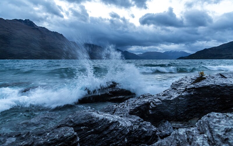Waves Crashing on Rocks — Blue, Dramatic, Afternoon, Photograph, Mountains, Clouds