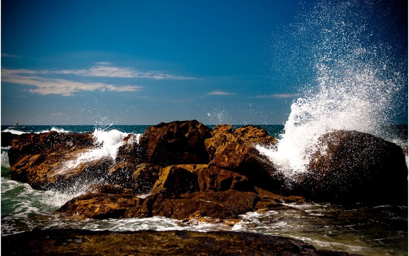 Waves Crashing on Rocks — Blue, Dramatic, Afternoon, Photograph, Ocean, Sky, Boat