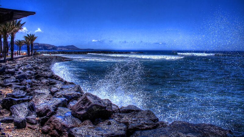 Waves Crashing on Rocks — Blue, Dramatic, Afternoon, Photograph, Palm Trees
