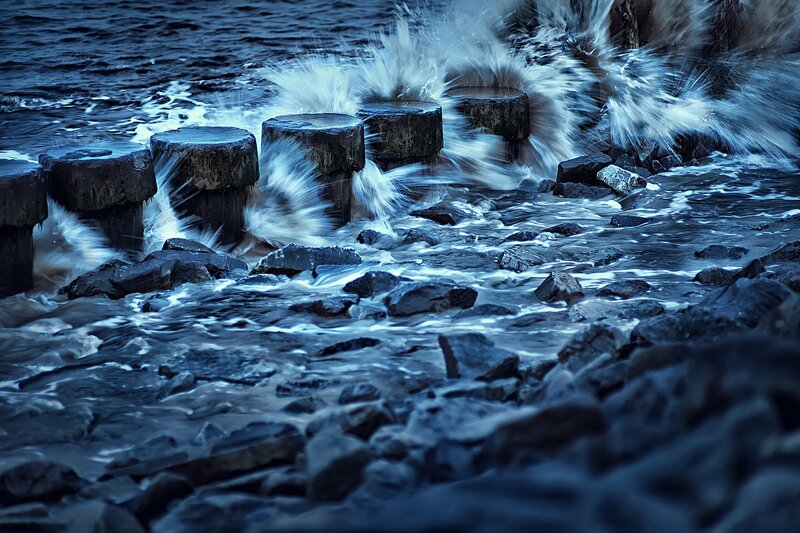 Waves Crashing on Rocks — Blue, Dramatic, Night, Photograph, Wooden Posts