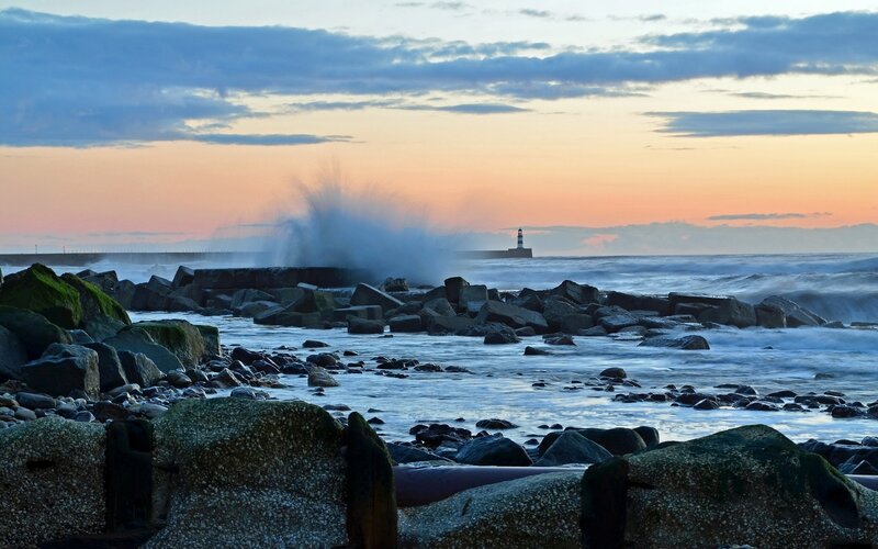 Waves Crashing on Rocks — Blue, Dramatic, Sunset, Photograph, Lighthouse