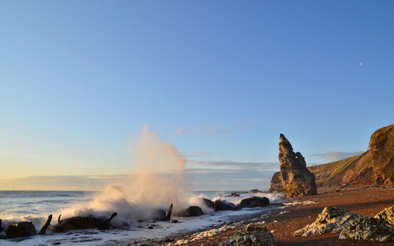 Waves Crashing on Rocks — Blue, Dramatic, Sunset, Photograph, Rock Formation
