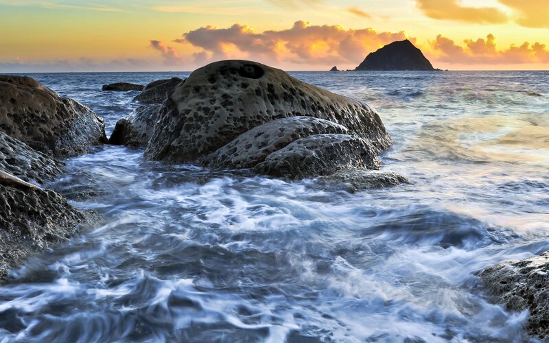 Waves Crashing on Rocks — Blue, Serene, Sunset, Photograph, Ocean, Sky, Island