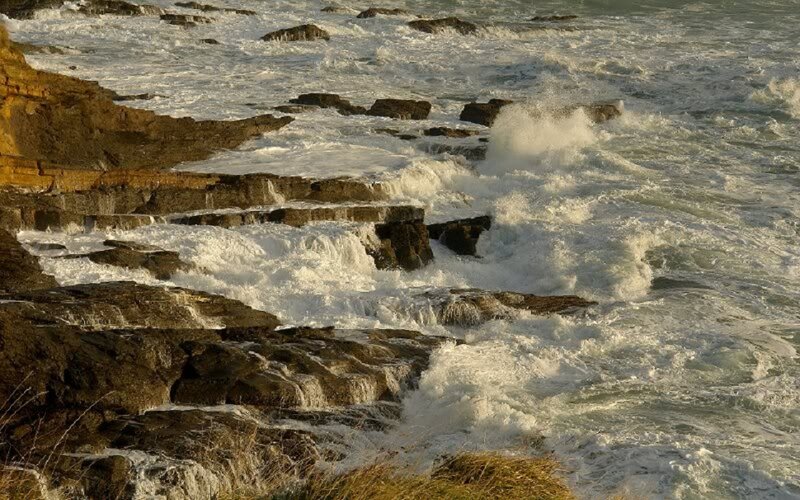 Waves Crashing on Rocks — Brown