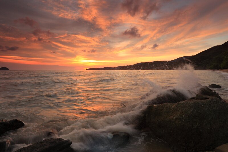 Waves Crashing on Rocks — Orange, Dramatic, Sunset, Photograph, Ocean, Sky, Mountain
