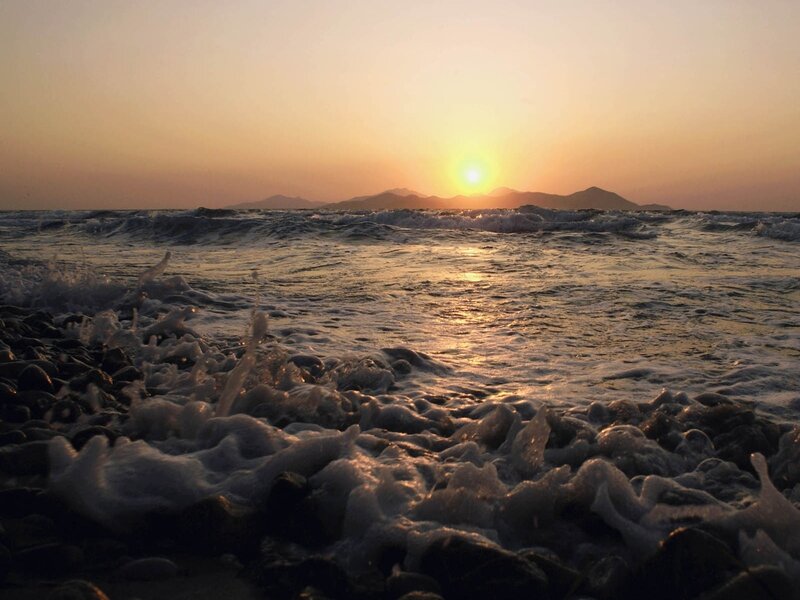 Waves Crashing on Rocks — Orange, Serene, Sunset, Photograph, Sun, Mountains