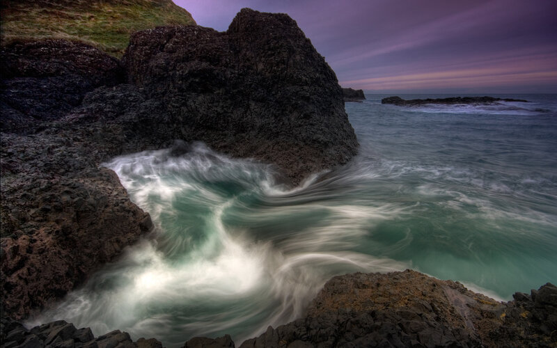 Waves Crashing on Rocks — Sunset, Black