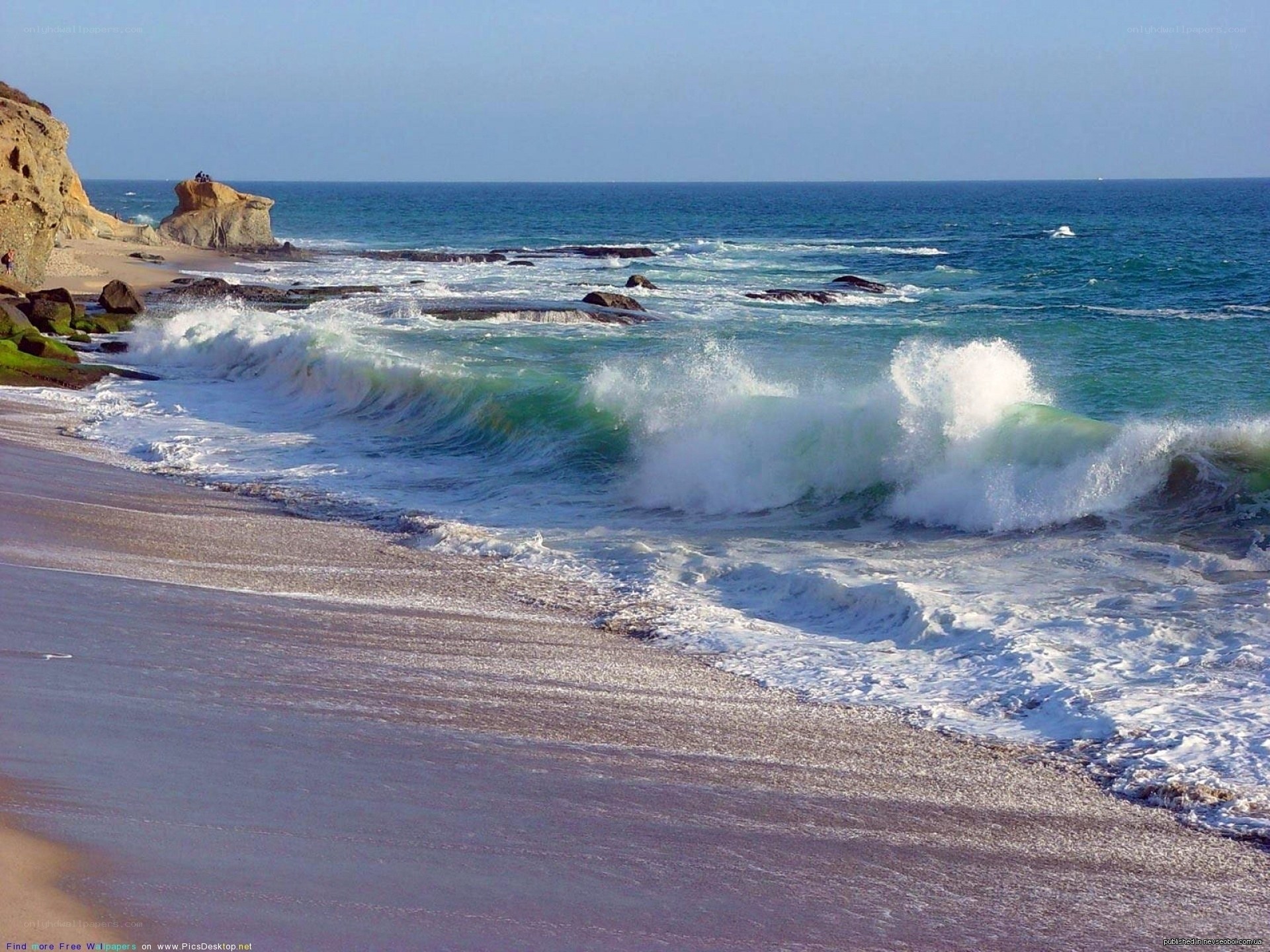 Waves crashing on rocky beach