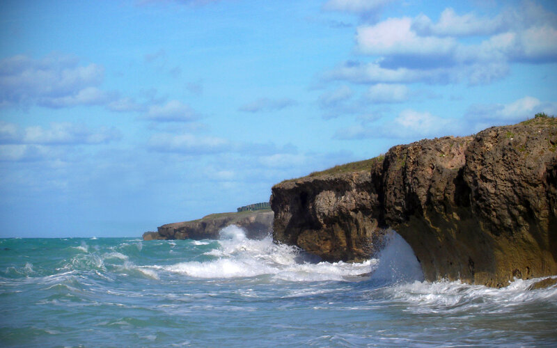 Waves crashing on rocky cliffs