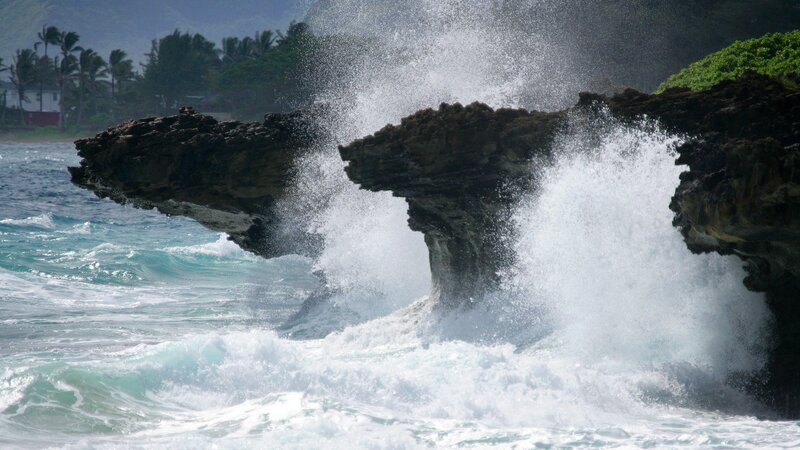 Waves crashing on rocky cliffs