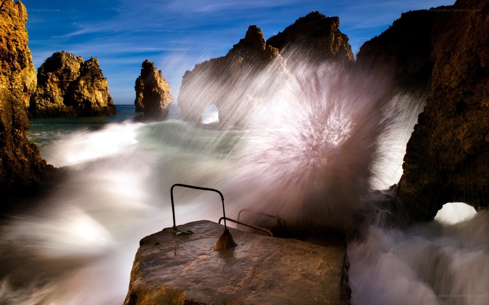 Waves crashing on rocky cliffs