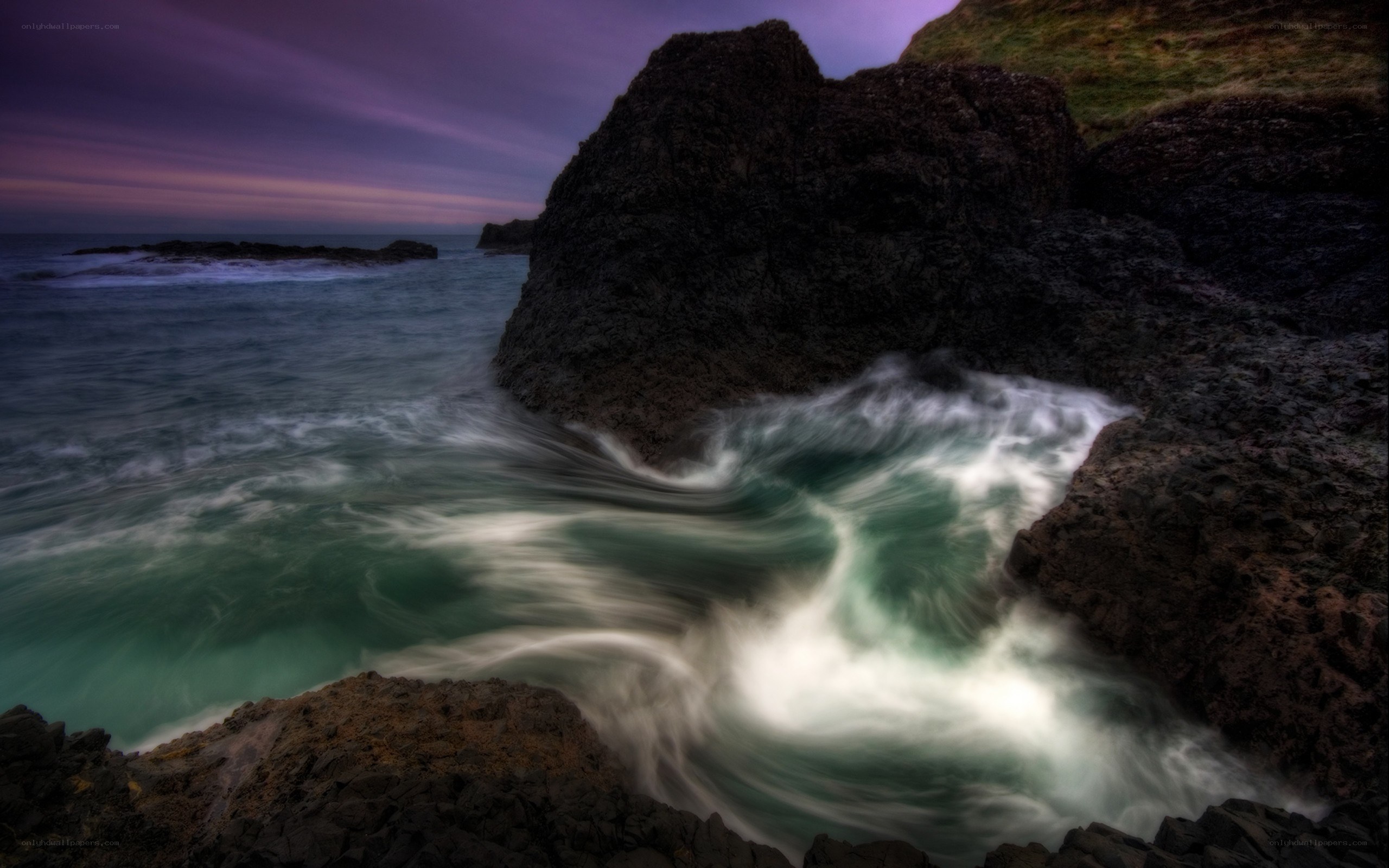 Waves crashing on rocky coast
