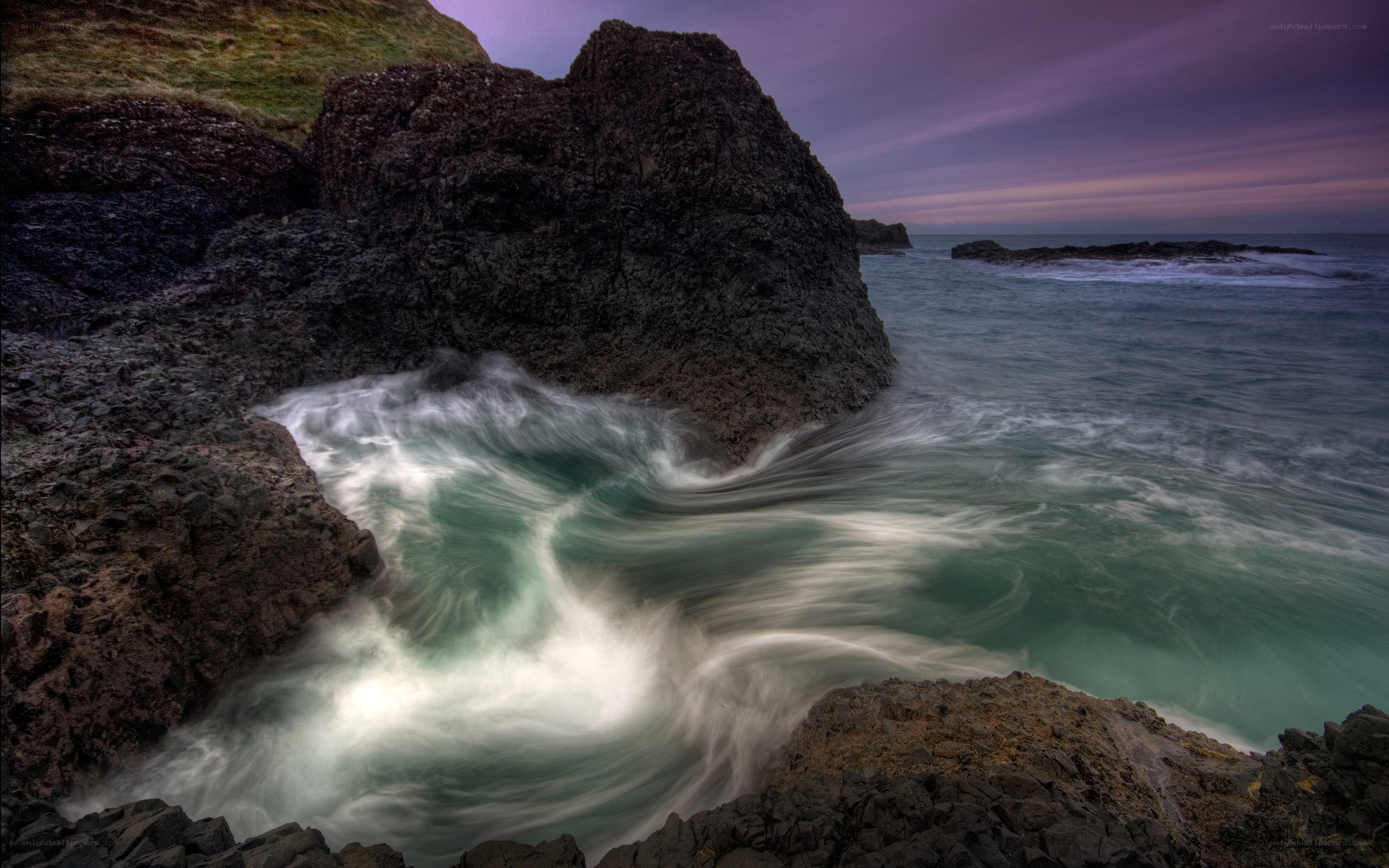 Waves crashing on rocky coast