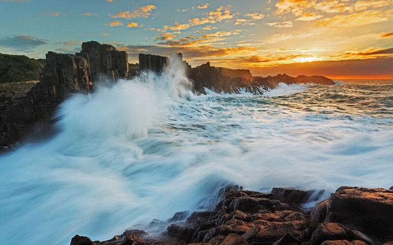 Waves crashing on rocky coast
