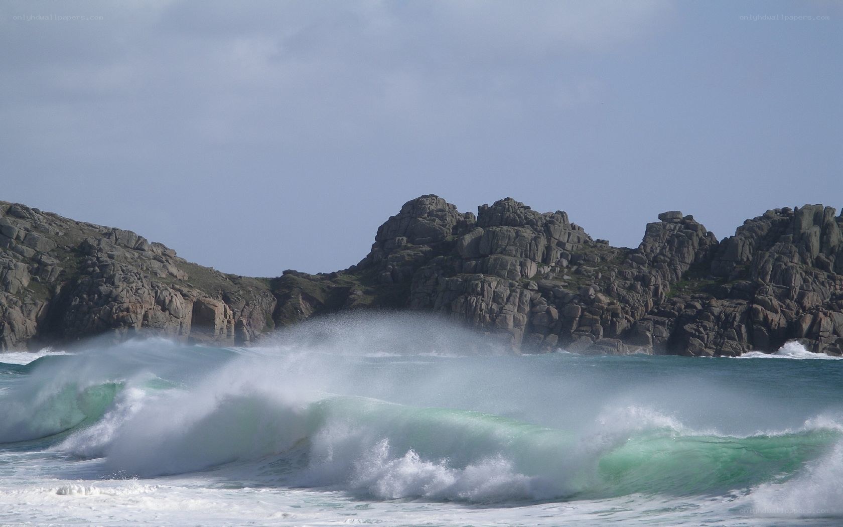 Waves crashing on rocky coast