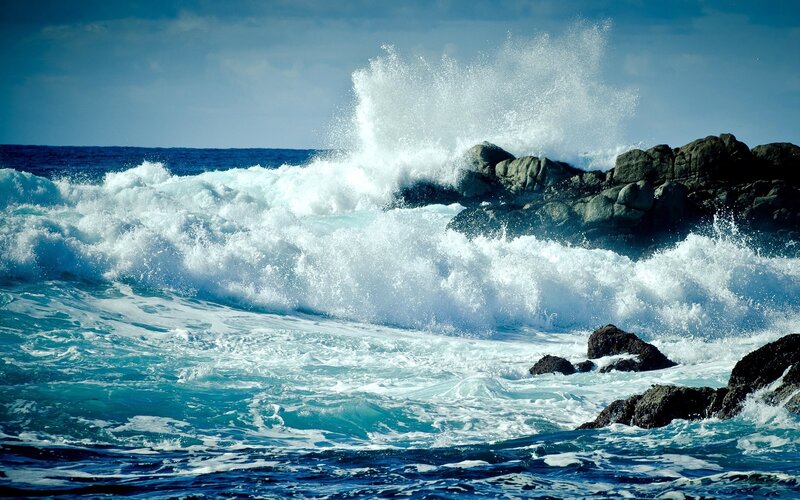 Waves crashing on rocky shore