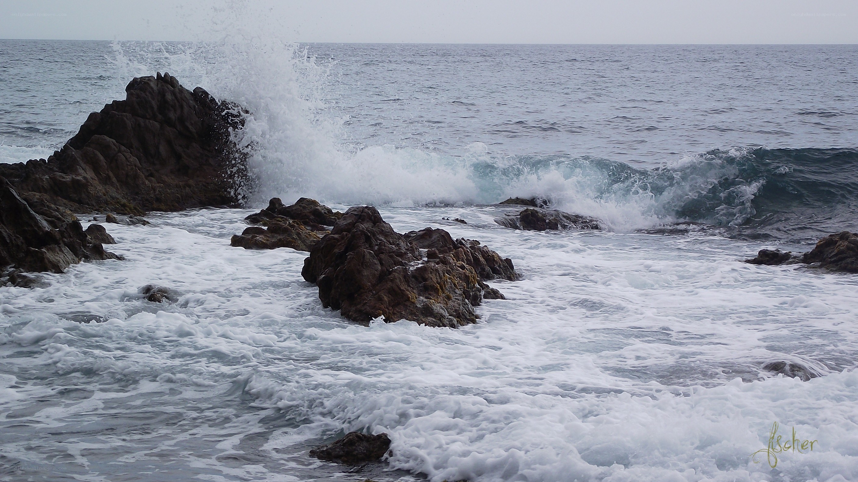 Waves crashing on rocky shore