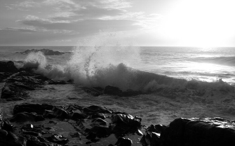 Waves crashing on rocky shore