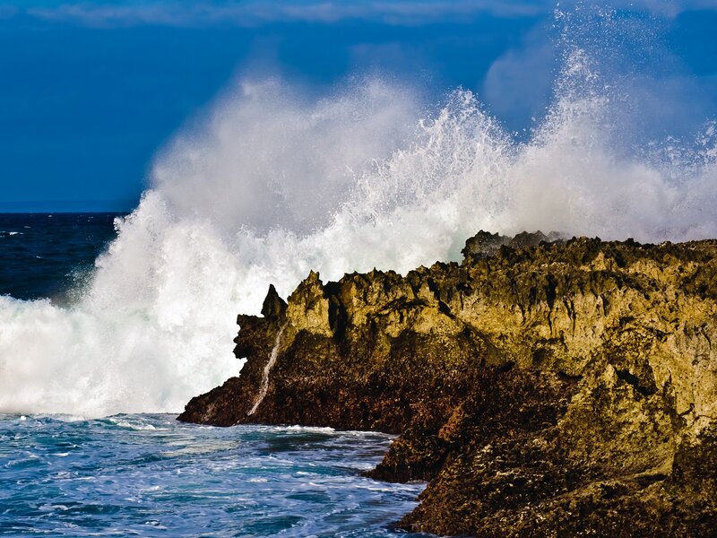 Waves crashing on rocky shore