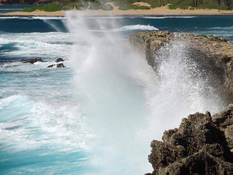 Waves crashing on rocky shore