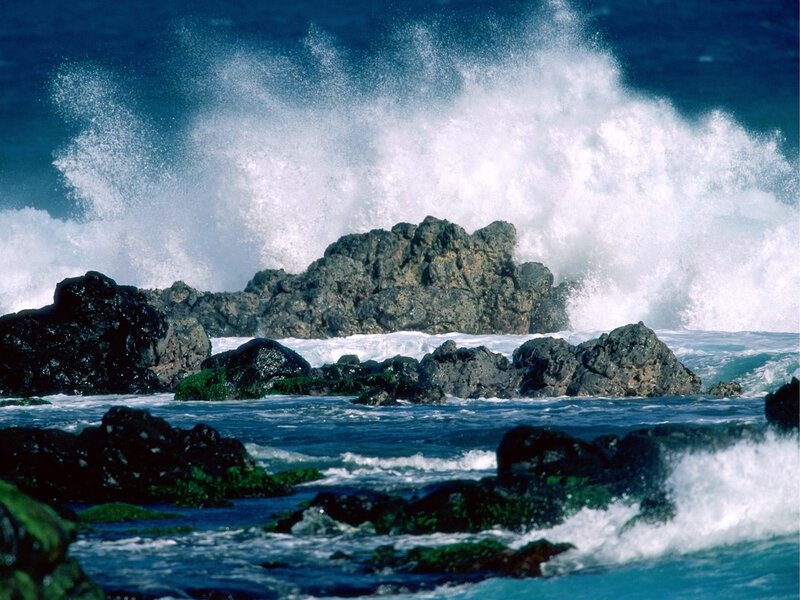 Waves crashing on rocky shore