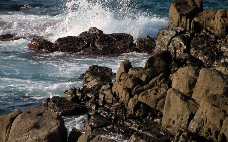 Waves crashing on rocky shore