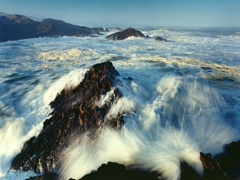 Waves crashing on rocky shore