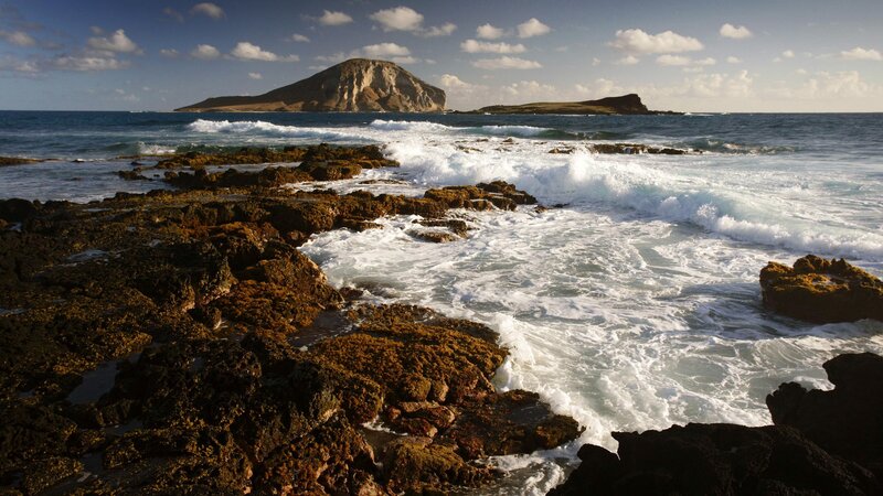 Waves crashing on rocky shore