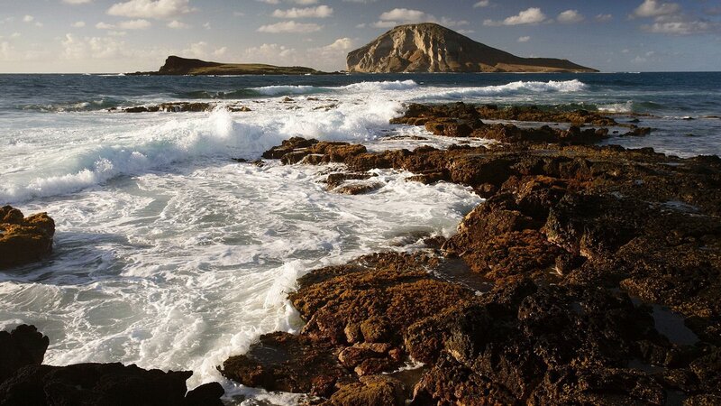 Waves crashing on rocky shore