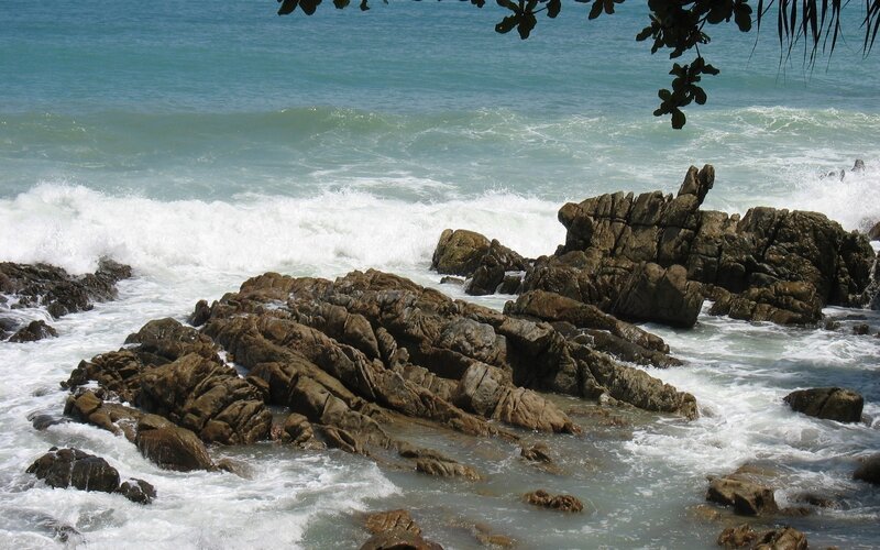 Waves crashing on rocky shore