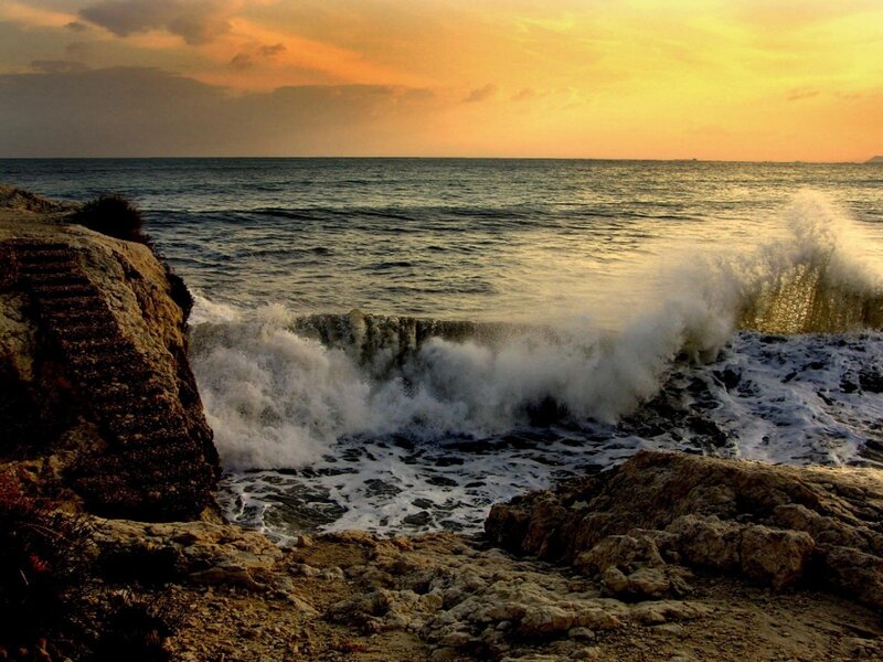 Waves crashing on rocky shore
