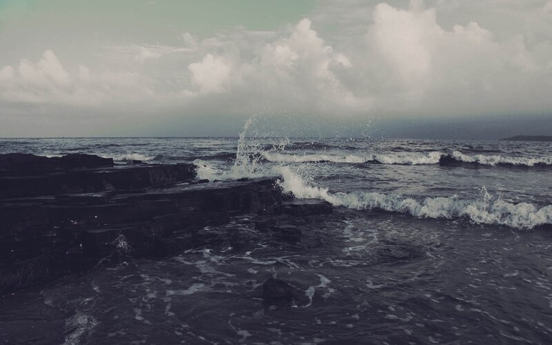 Waves crashing on rocky shore