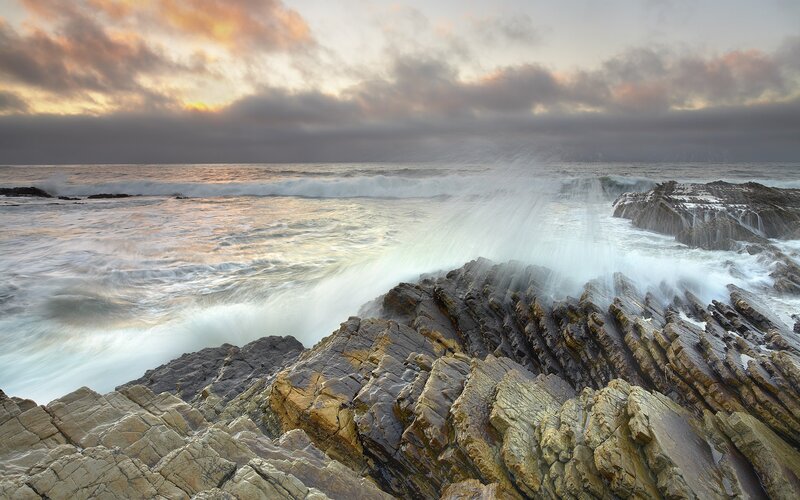 Waves crashing on rocky shore