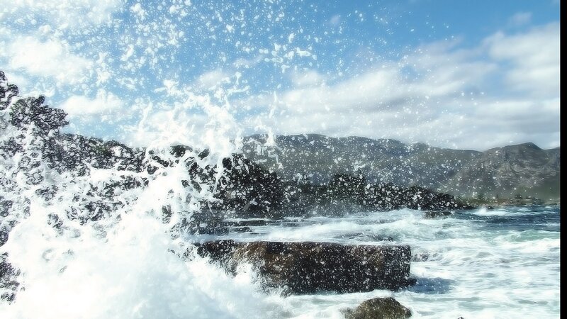 Waves crashing on rocky shore