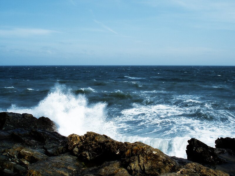 Waves crashing on rocky shore