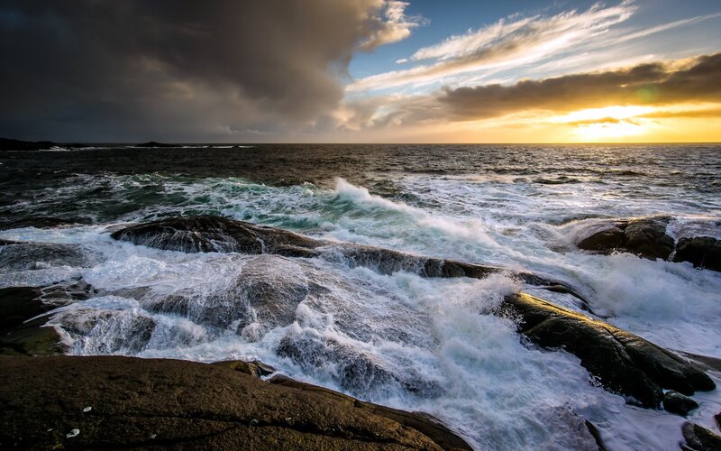 Waves crashing on rocky shore