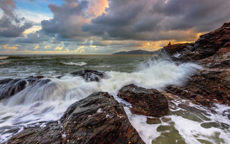 Waves crashing on rocky shore