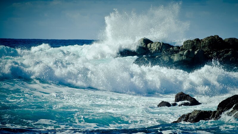 Waves crashing on rocky shore