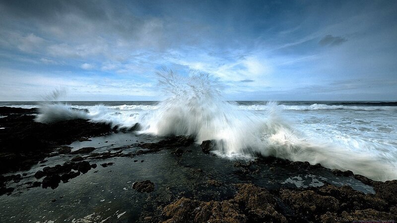 Waves crashing on rocky shore