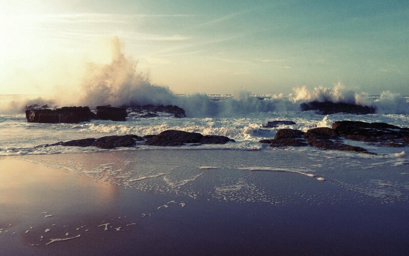 Waves crashing on rocky shore